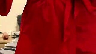 I love watching this brunette in red lingerie tease her big tits and ass