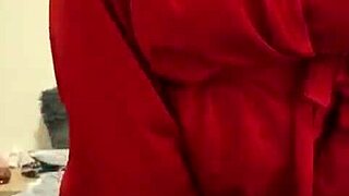 I love watching this brunette in red lingerie tease her big tits and ass