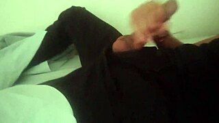 horny guy in black pants groans while stroking big cock after work