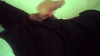 horny guy in black pants groans while stroking big cock after work