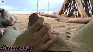 student handjobs cock on stormy beach in public voyeur cumshot