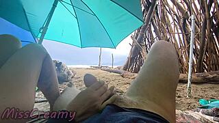 student handjobs cock on stormy beach in public voyeur cumshot