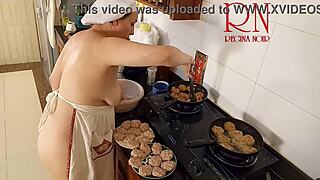 Nudist Housewife Regina Noir Cooks in the Kitchen with Naked Maid Assistance in Chapter One.