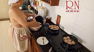 Nudist Housewife Regina Noir Cooks in the Kitchen with Naked Maid Assistance in Chapter One.