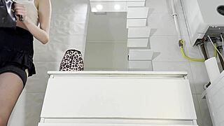 check out this redhead college babe flashing pussy and ass in bathroom