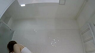 check out this redhead college babe flashing pussy and ass in bathroom