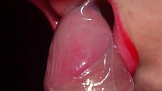 Red lips devour condom-wrapped cock close-up