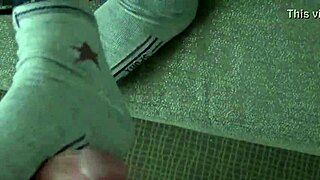 Shana's sexy 18+ feet stroke cock in steamy footjob close-up.
