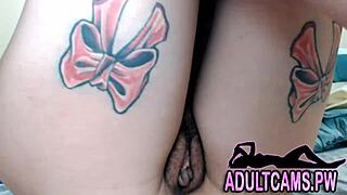 Sexy tattoo chick with dildo on webcam
