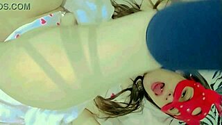 Hot and naughty student sucking lollipops at the bed wearing new white lingerie